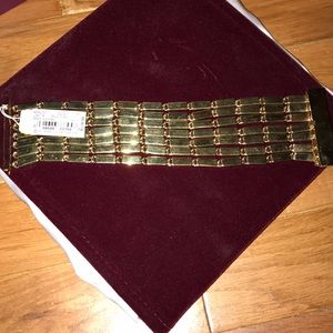 Kate Spade 7" gold tone bracelet. Never worn